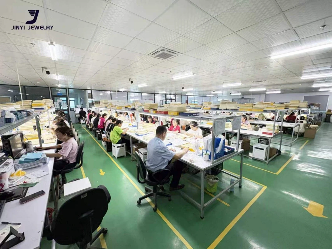 JINYI Vietnam Jewelry Factory Work Area Wide view of an authorized JINYI Vietnam factory workshop with multiple staffed work areas and organized inspection trays