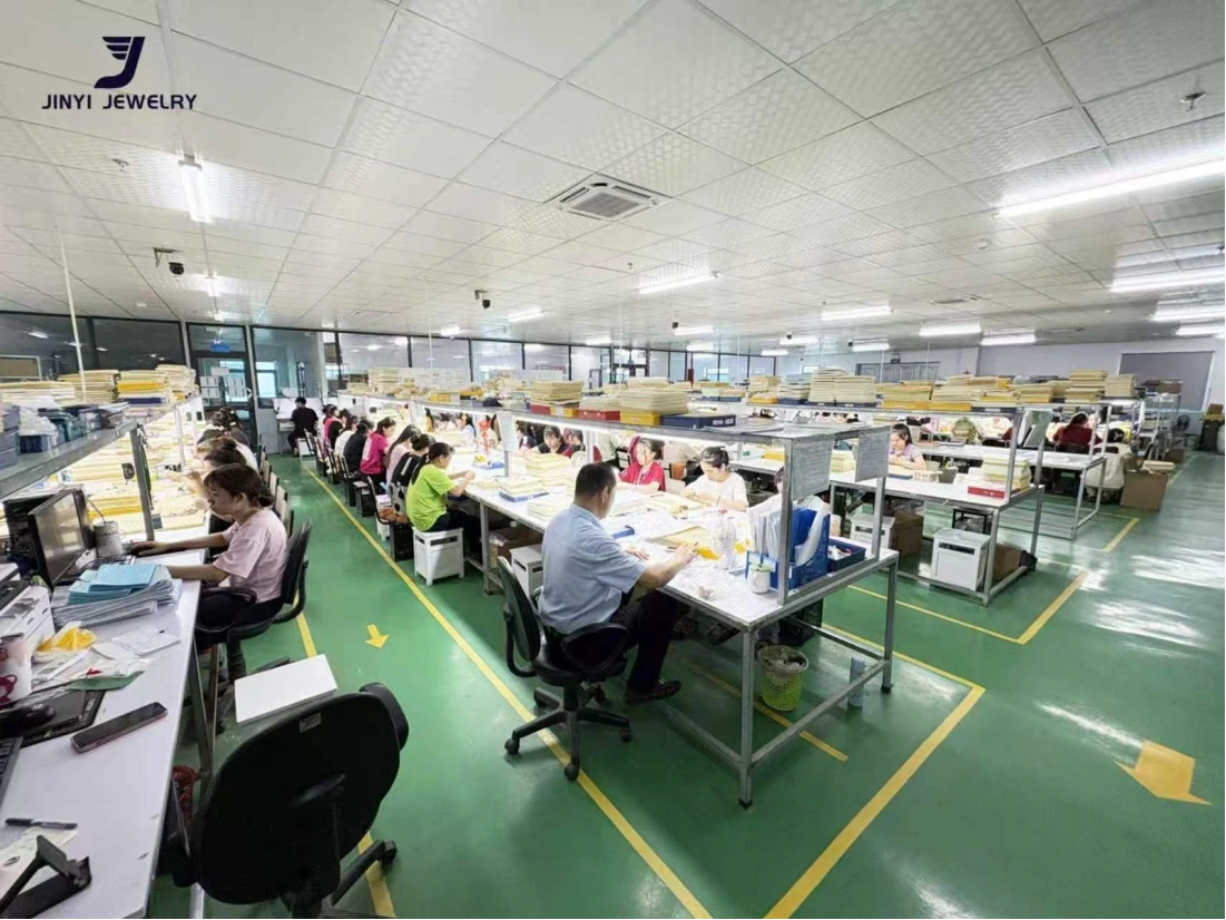 JINYI Vietnam Jewelry Factory Production Scale Authorized JINYI Vietnam factory photo showing a large organized workshop with staffed jewelry work areas