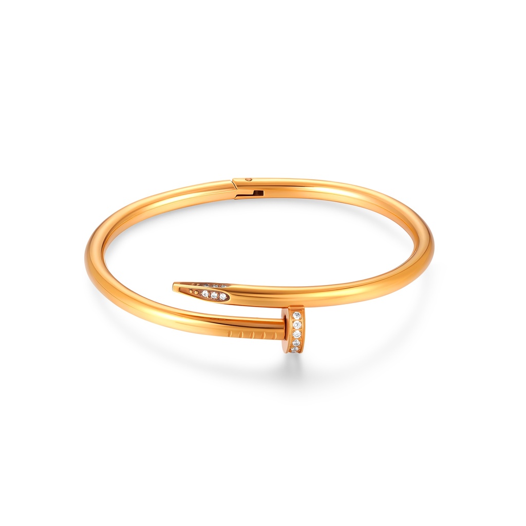 Chic rose gold nail bracelet with modern crystal detailing finish.